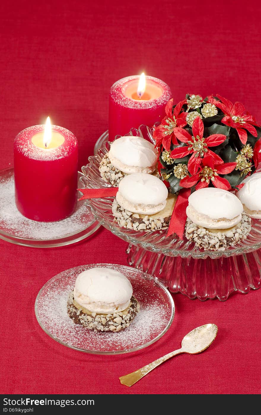 Christmas decoration with candles ribbons and cookies