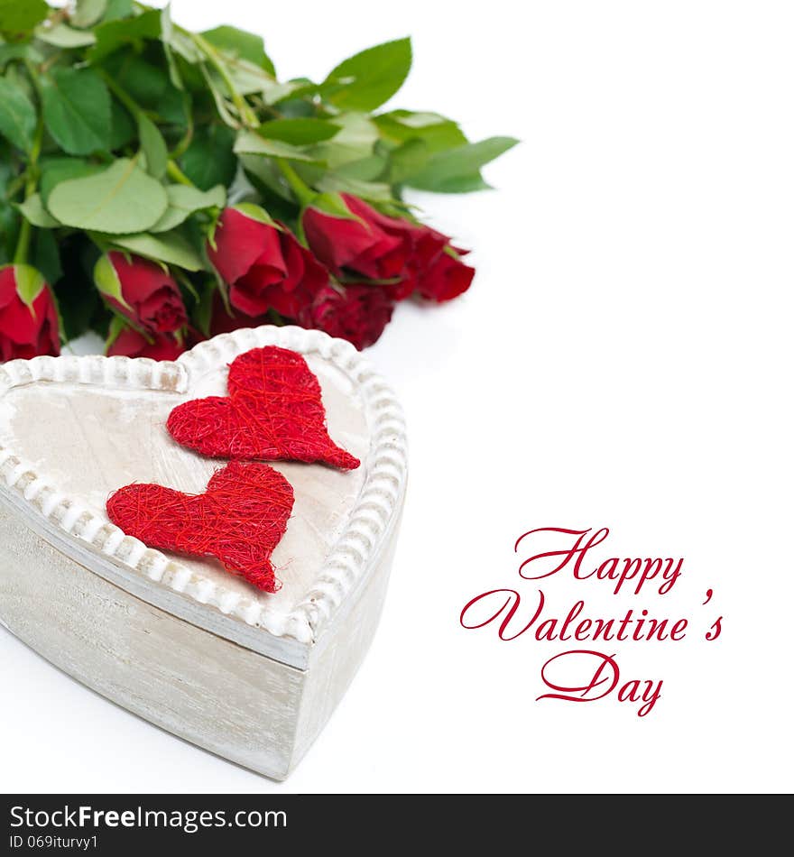 Wooden box with red hearts and roses, isolated on white