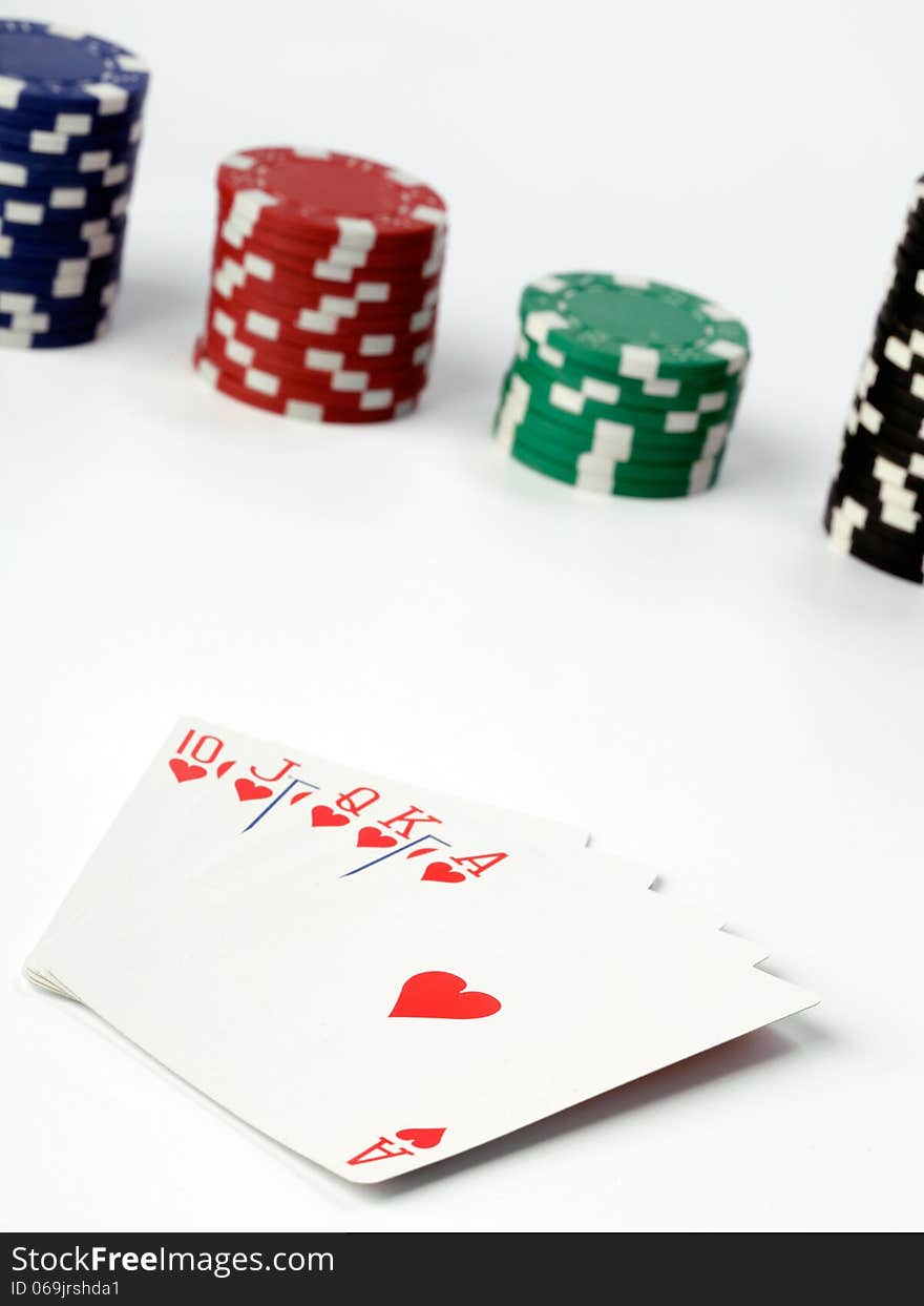 playing cards and poker chips on white