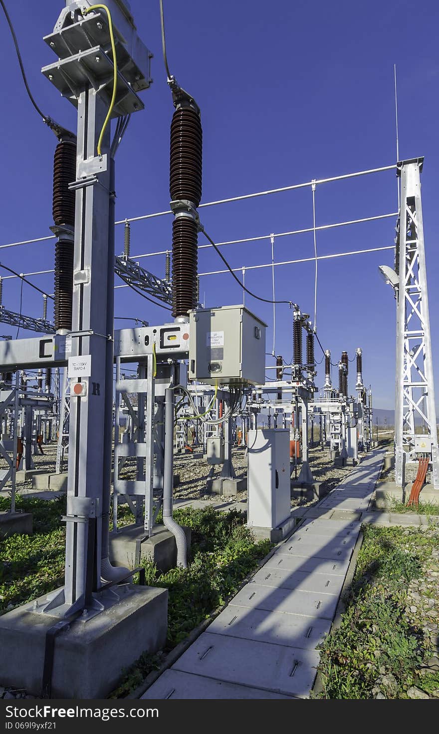 Modern medium voltage distribution station. The station is relatively new (it was builted 2 years ago) and it has almost latest of the technology aplied. Ligtning rod in the right side of the photo. Industrial zone near Brasov. Modern medium voltage distribution station. The station is relatively new (it was builted 2 years ago) and it has almost latest of the technology aplied. Ligtning rod in the right side of the photo. Industrial zone near Brasov.