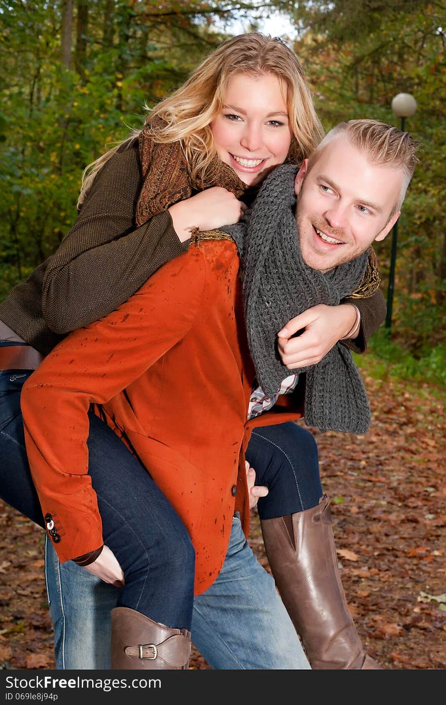 Happy young couple is having a nice time in october. Happy young couple is having a nice time in october