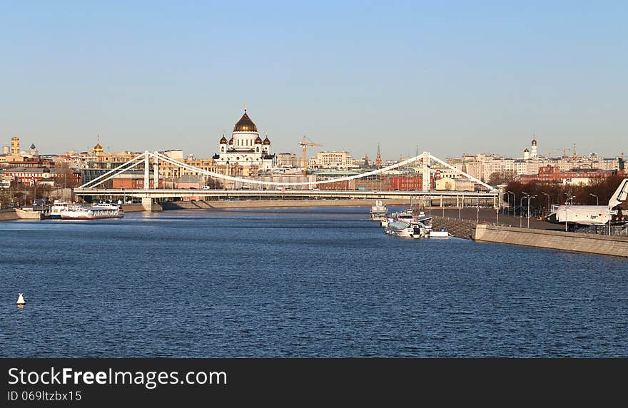 Beautiful river landscape with a bridge and temples in Moscow