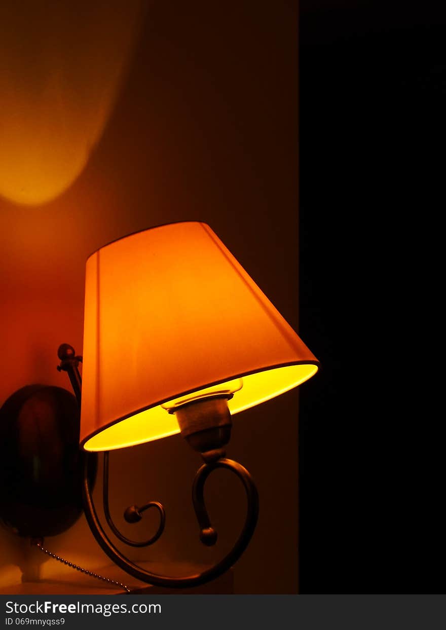 A vintage lamp on a dark, romantic background. A vintage lamp on a dark, romantic background.