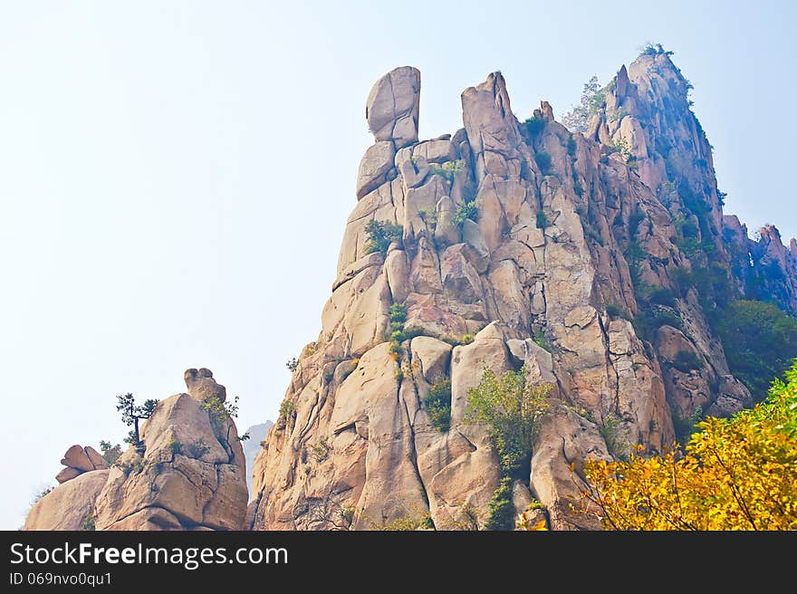 The cliff peak and autumnal scenery