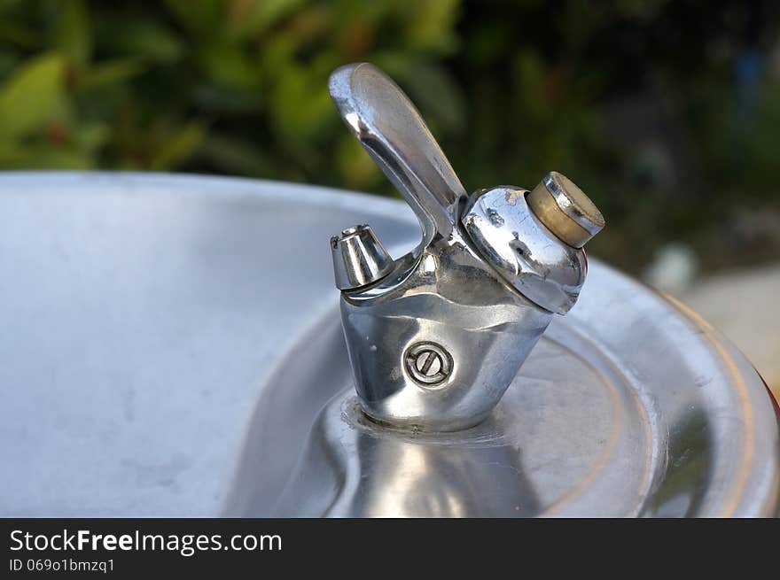 Closeup picture of water-tap of drinking machine.