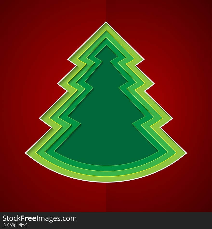 Green paper christmas tree on red background