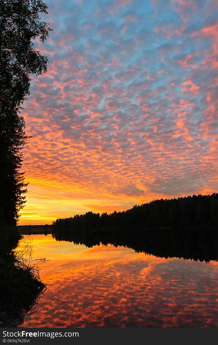 Dramatic sunset over the river in Karelia, the north of Russia. Dramatic sunset over the river in Karelia, the north of Russia