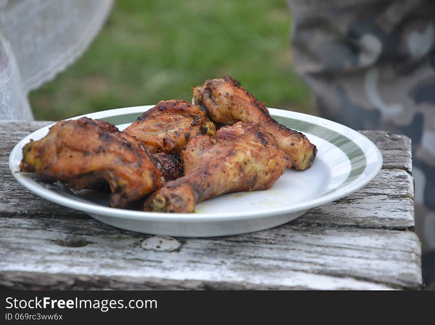 Grilled meat on the wooden table in the garden