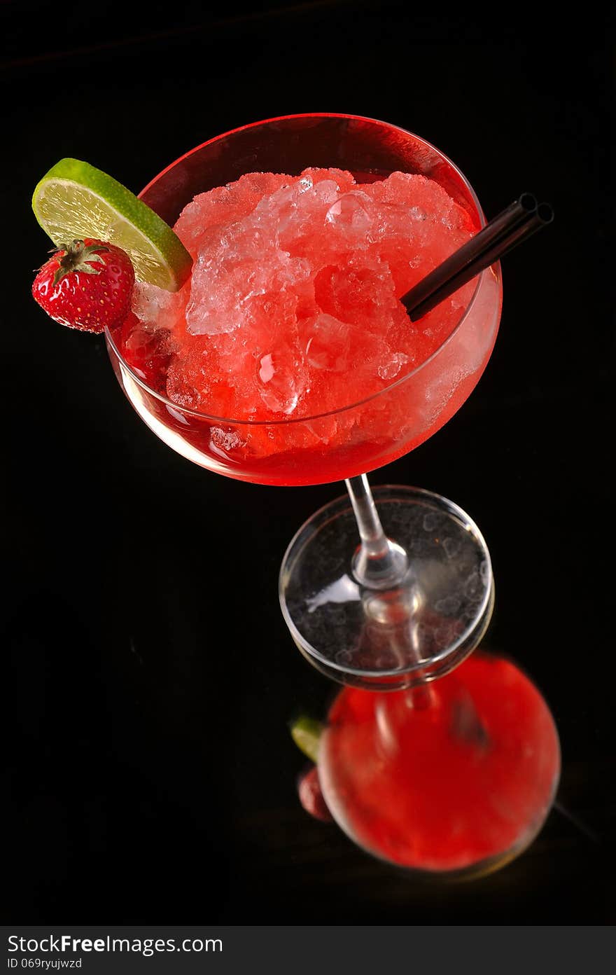 Strawberry margarita cocktail on black background