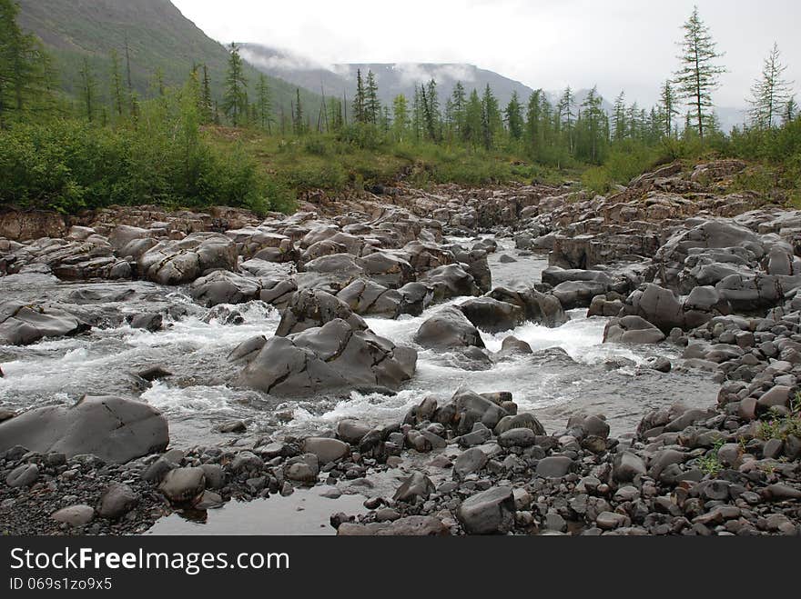 Photo waterfall, made during a hike in 2011 on the Putorana plateau. Taimyr Peninsula, Russia. Photo waterfall, made during a hike in 2011 on the Putorana plateau. Taimyr Peninsula, Russia.