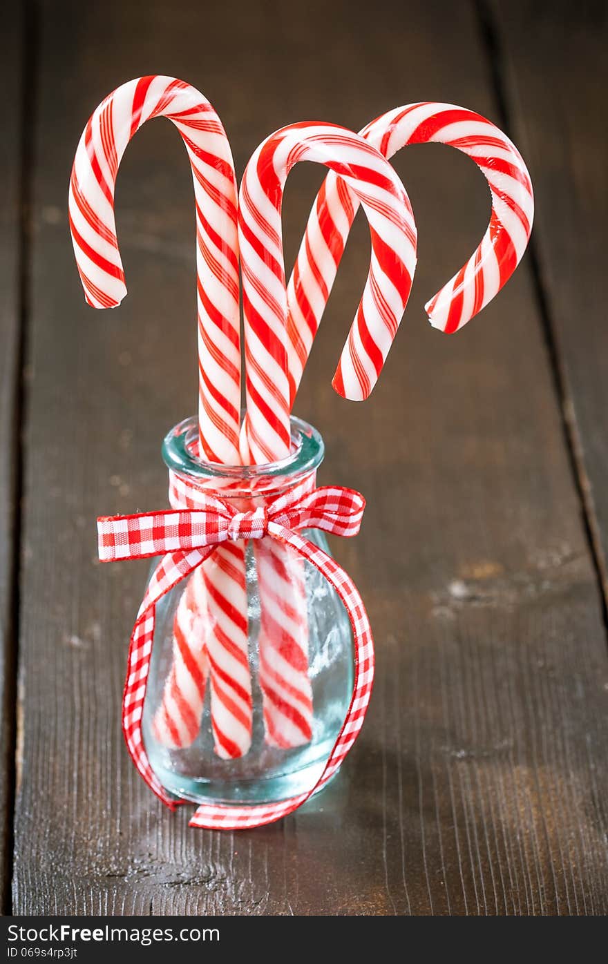 Christmas candy canes in glass jar