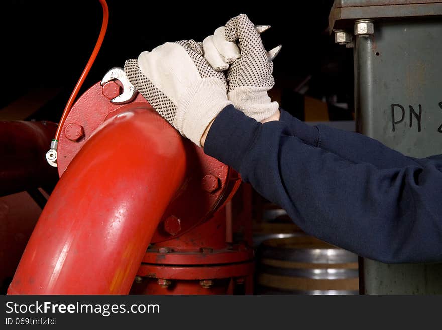 Maintanance skilled worker at work with pipes. Maintanance skilled worker at work with pipes