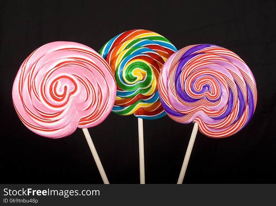 Colorful lollipops on a black background