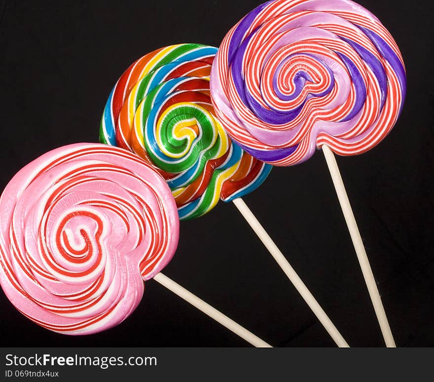 Colorful lollipops on a black background