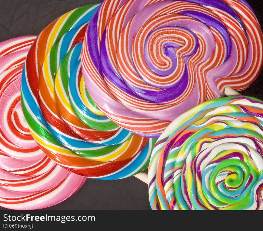 Colorful lollipops on a black background