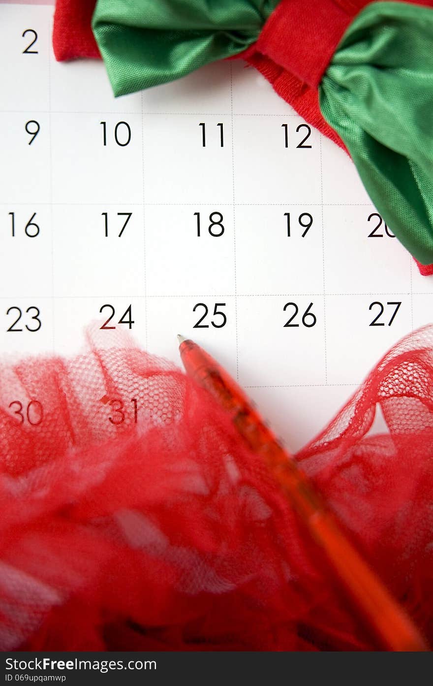 Pen point to christmas day on calendar. Pen point to christmas day on calendar