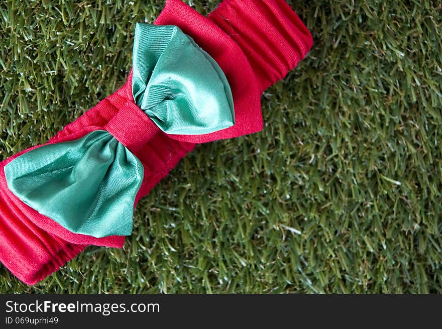 Christmas ribbon on grass