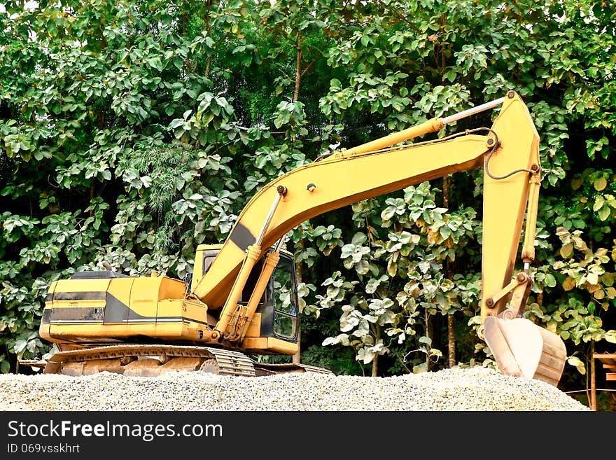 Excavator on a mound