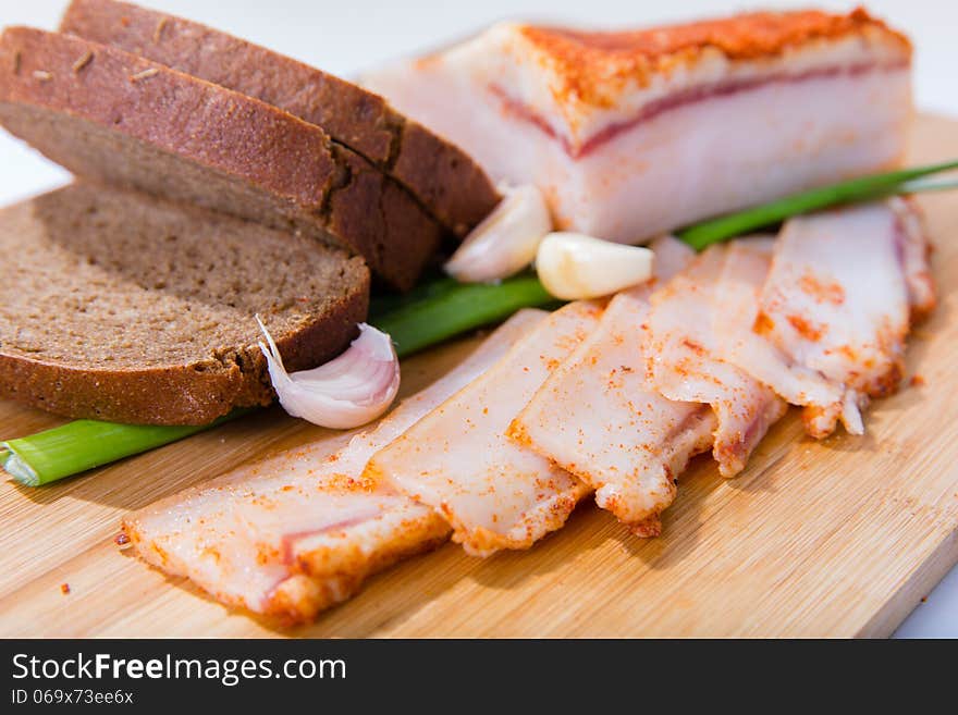 Sliced pork with garlic and spices on the table