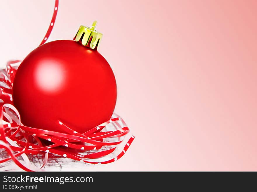 Red christmas ball with ribbon