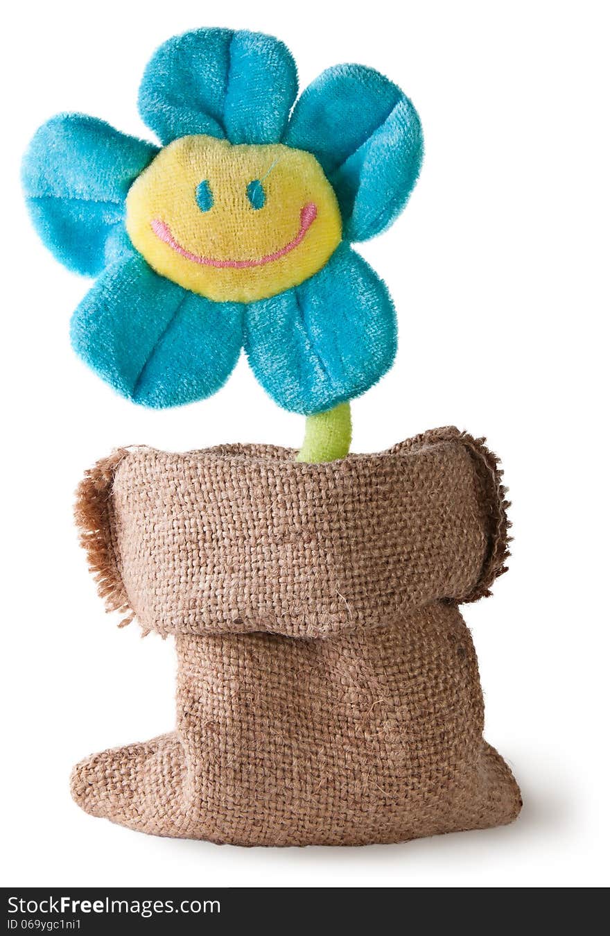 Plush flower in sack on white background