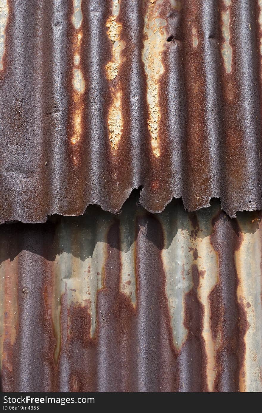 A rusty corrugated iron plate