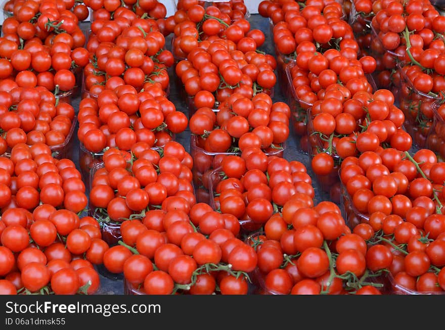 Market stand of cherry tomatoes