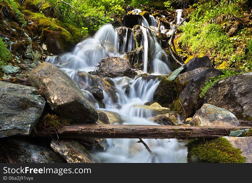 Waterfall In The Alps