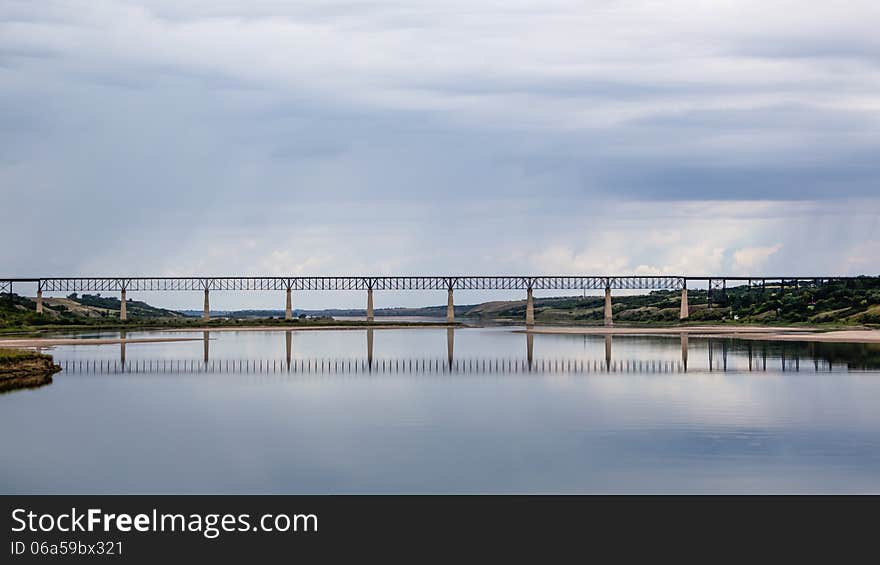 Long steel bridge across the lake