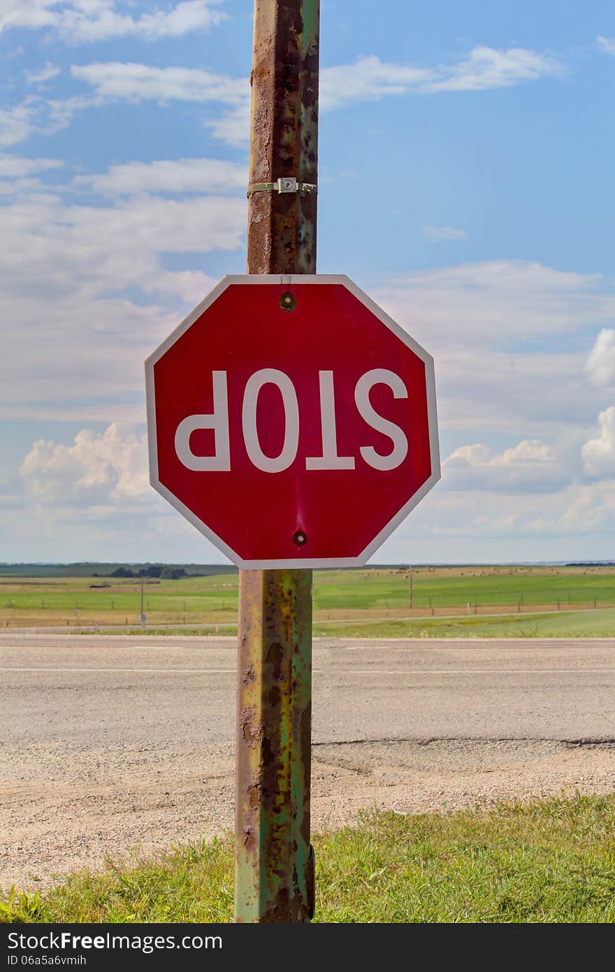 Upside down stop sign at an intersection. Upside down stop sign at an intersection