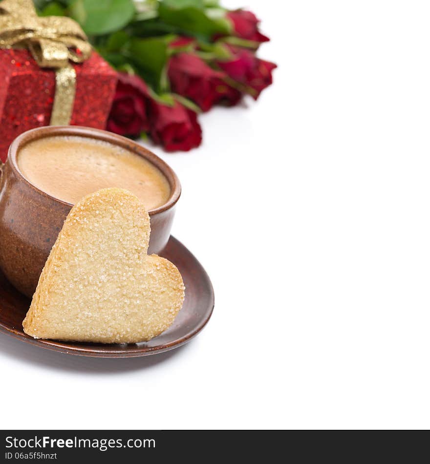 Coffee, cookie in the shape of heart, gift and roses