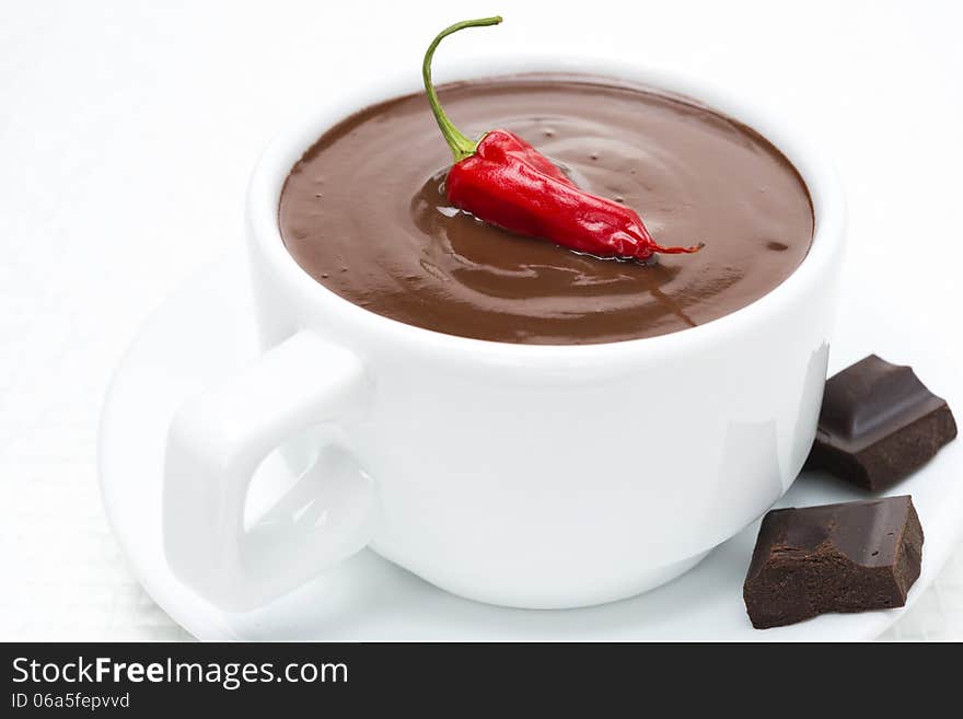 Cup of hot chocolate with chili, close-up