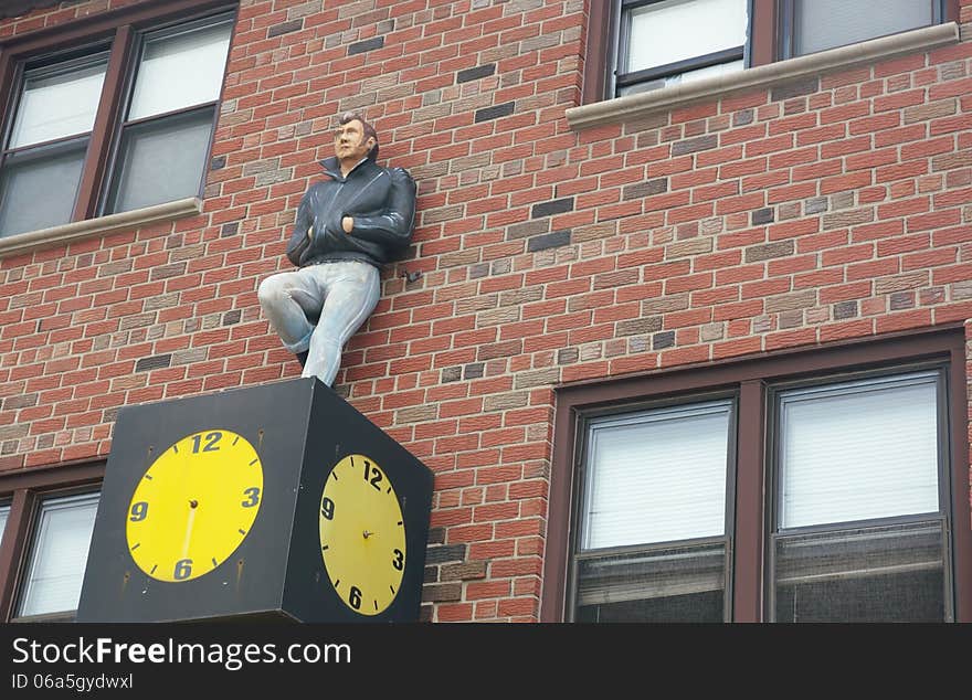 Mannequin on the wall clock as symbol of date ,but for him this date is perpetual. Mannequin on the wall clock as symbol of date ,but for him this date is perpetual