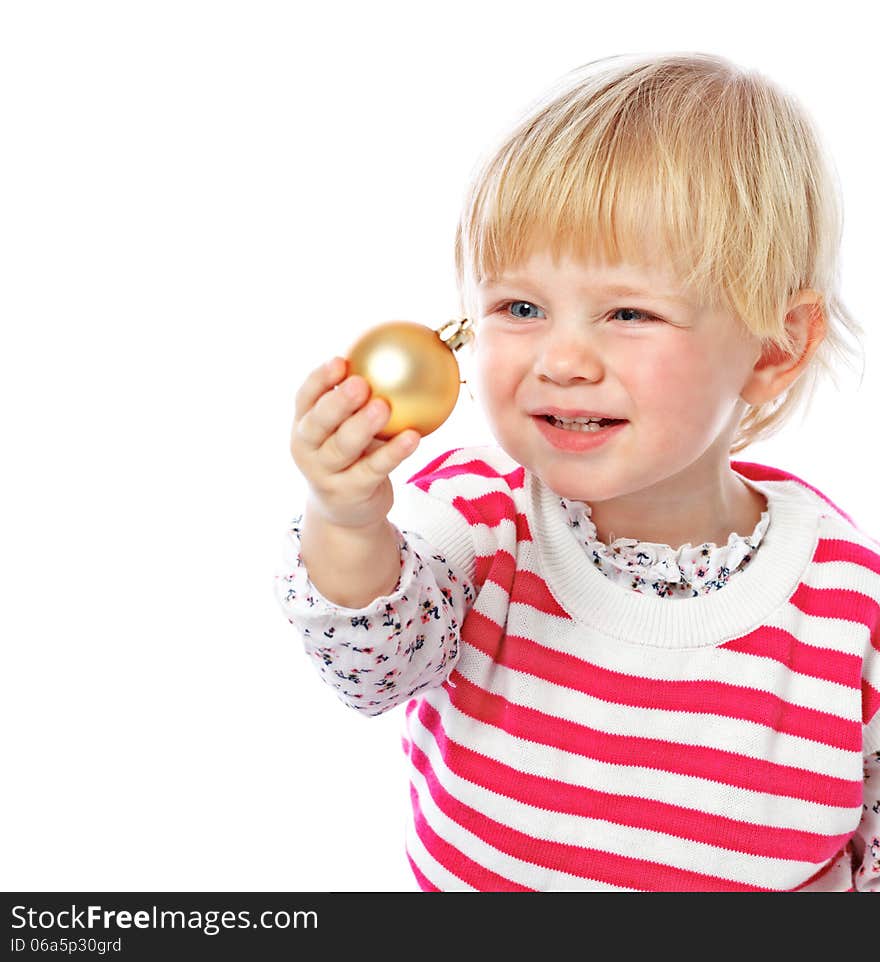 Portrait of a little girl holding a Christmas ball, celebration