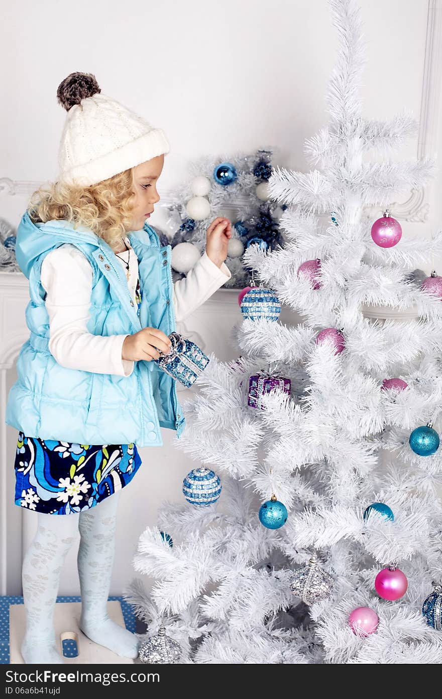 Little cute girl decorate Christmas tree. Little cute girl decorate Christmas tree