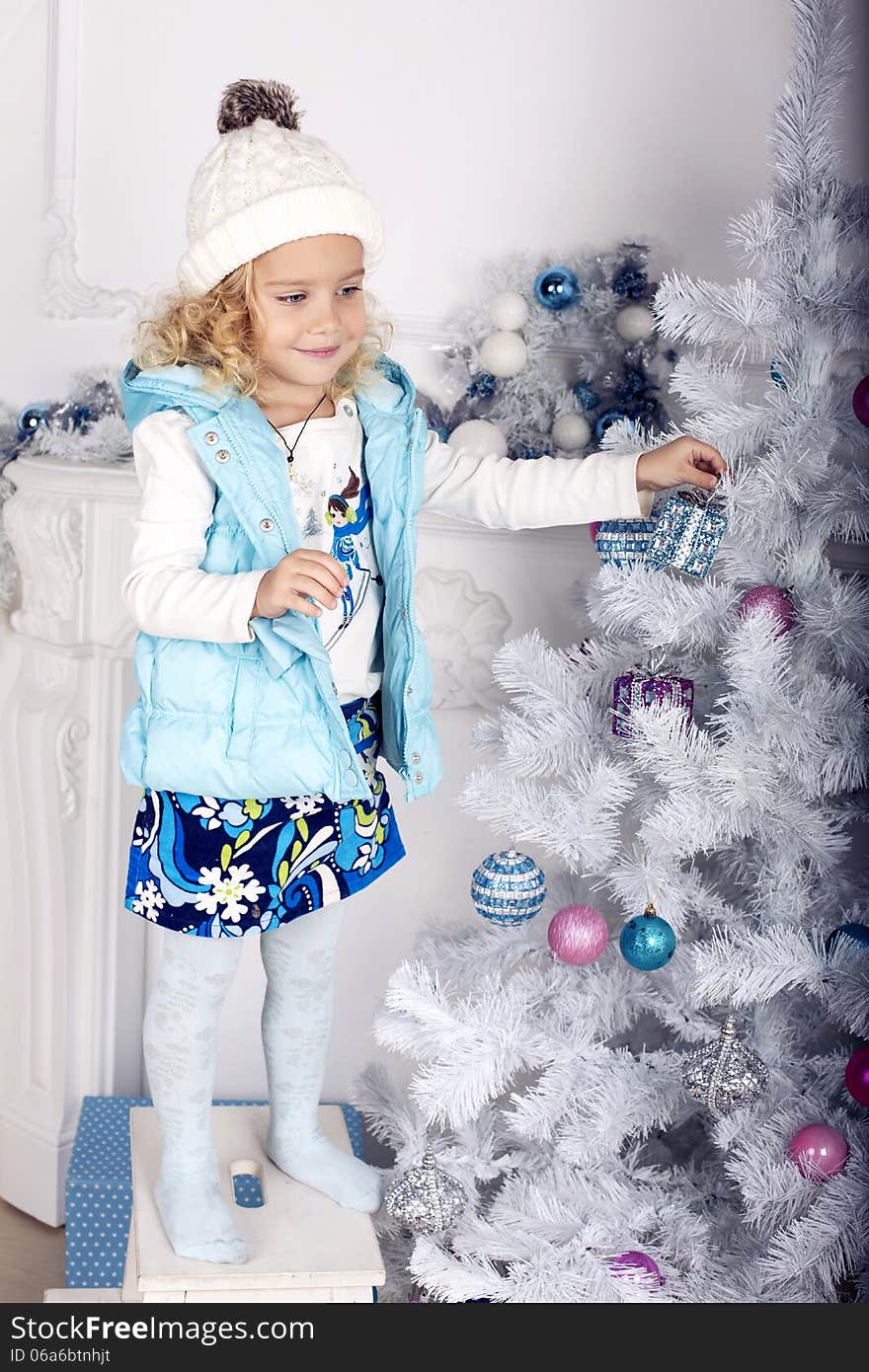 Little cute girl decorate Christmas tree. Little cute girl decorate Christmas tree