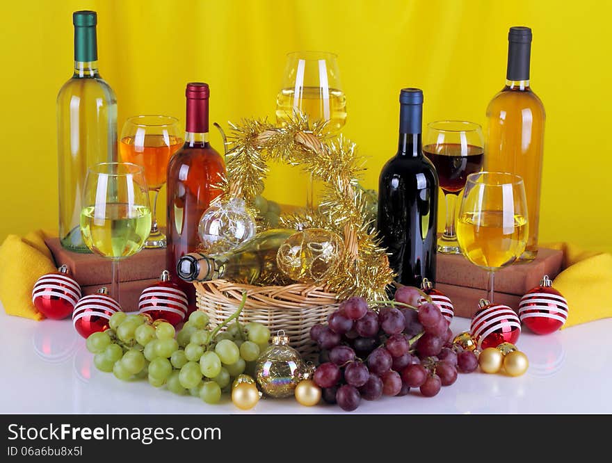 Bottles Of Wine With Grapes And Christmas Decorations