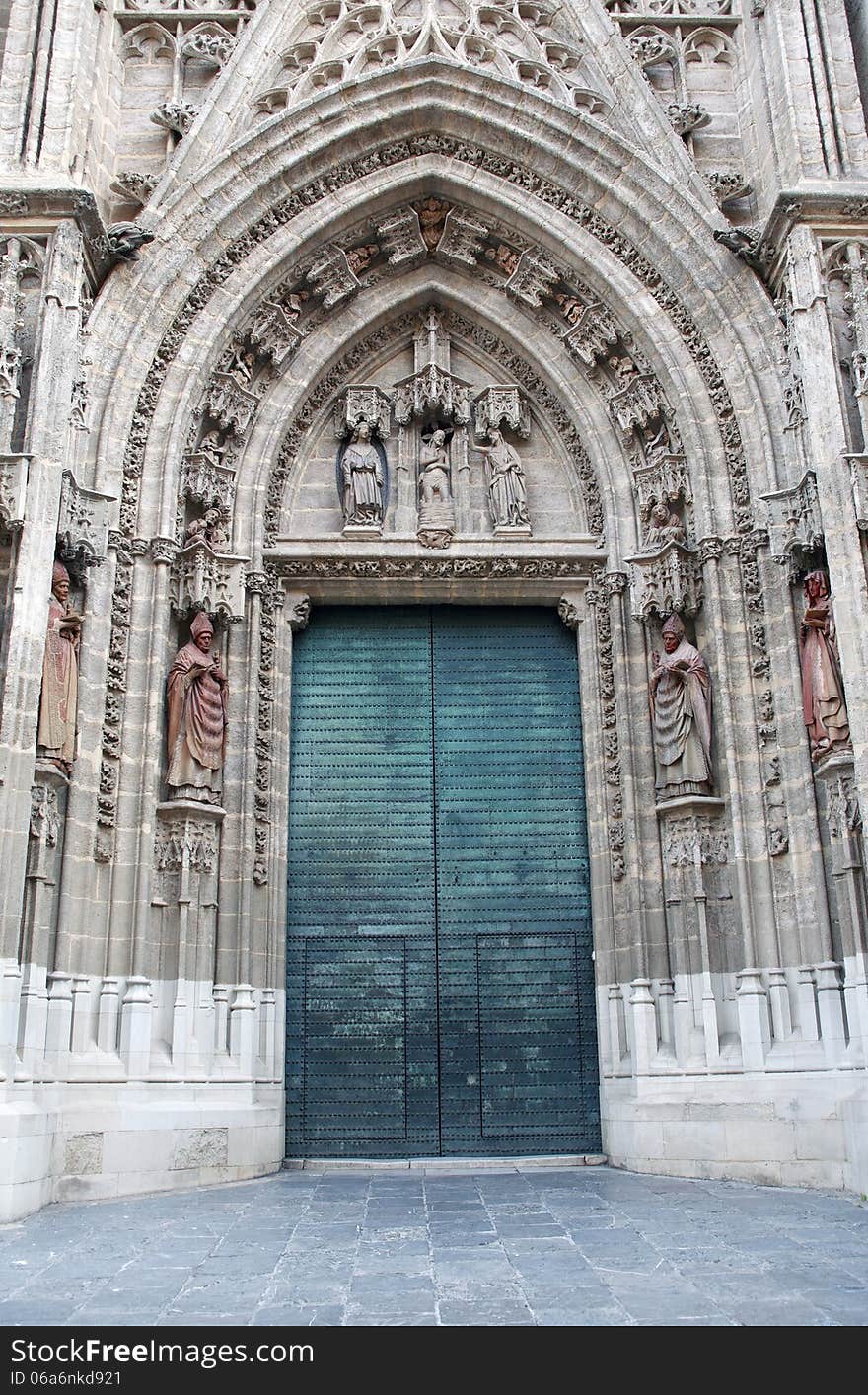 Old big metal door. Seville Cathedral, Spain, Europe. Old big metal door. Seville Cathedral, Spain, Europe