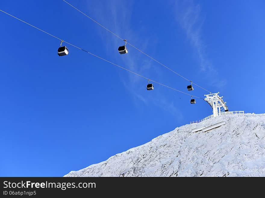 Ski lift chairs on bright winter day