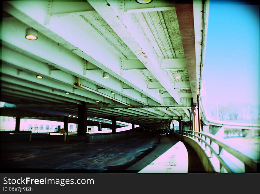 Urban scene. Below the viaduct of the city.