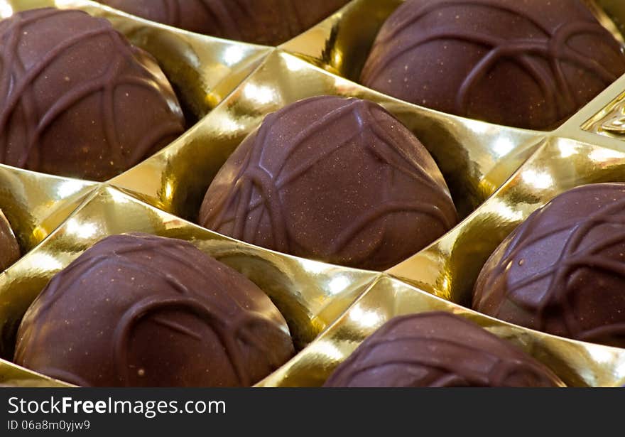 Chocolate Sweets In The Box On The White Background.