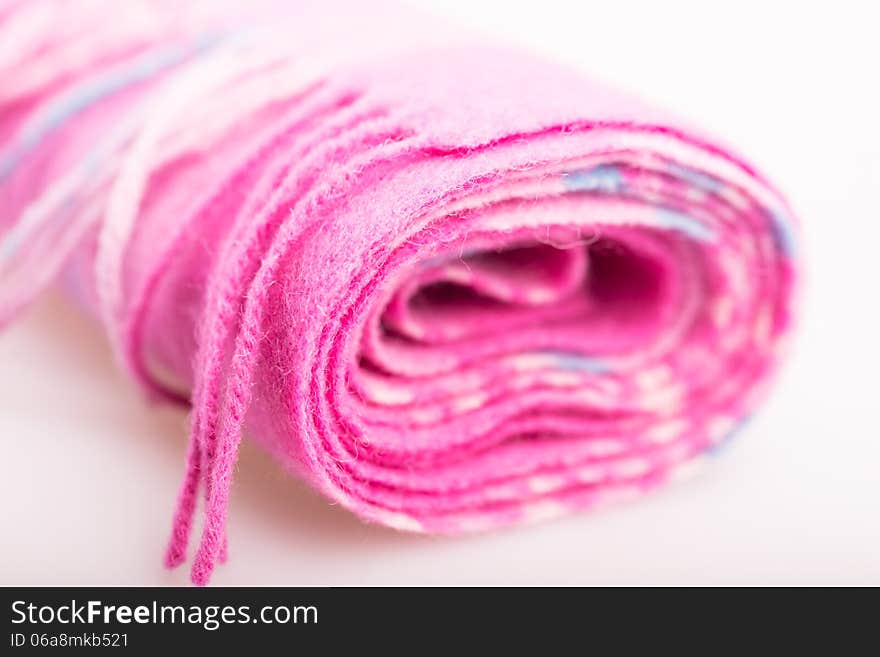 Woolen pink scarf close-up. Woolen pink scarf close-up