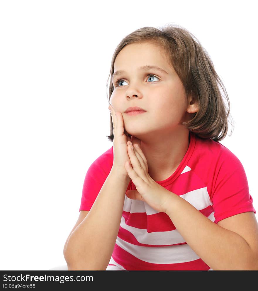 Portrait of a pretty little girl in red shirt on a white backgro