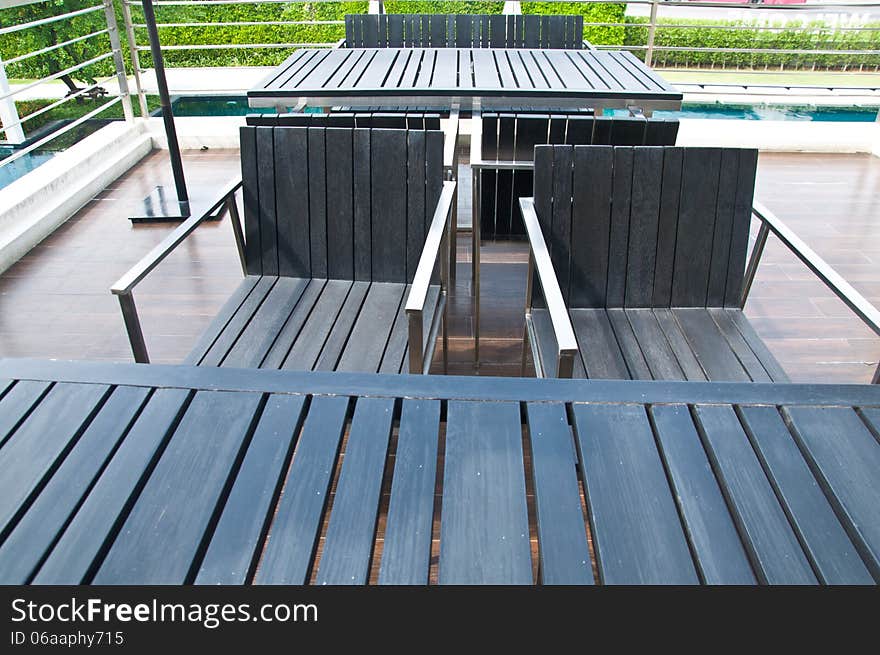 Table and chairs standing at patio