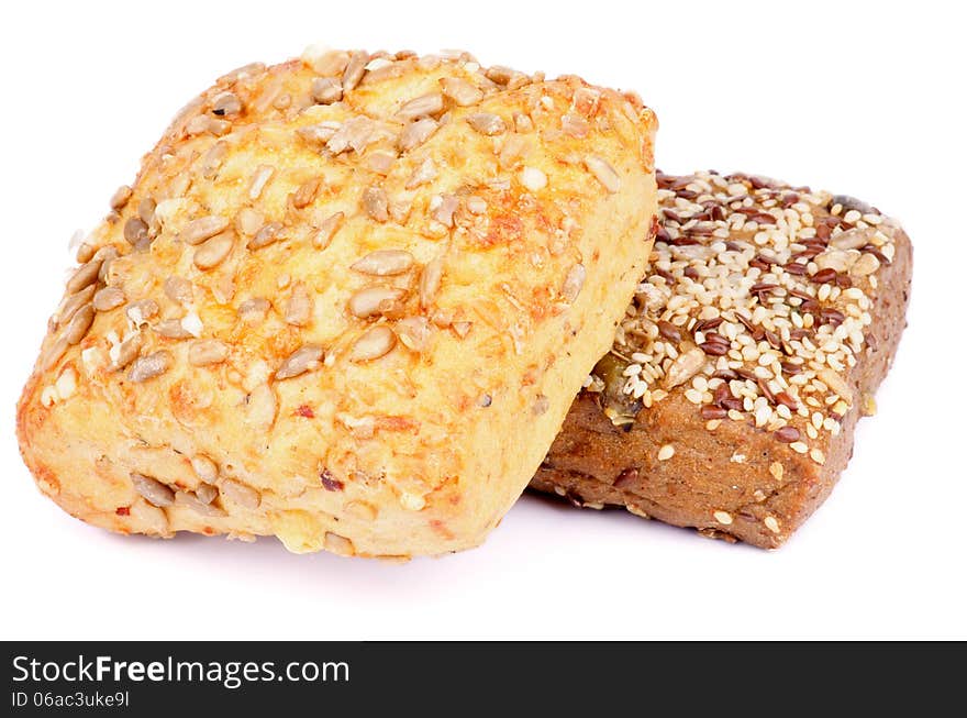 Heap of Sunflower Seeds and Sesame Seeds Buns isolated on white background. Heap of Sunflower Seeds and Sesame Seeds Buns isolated on white background