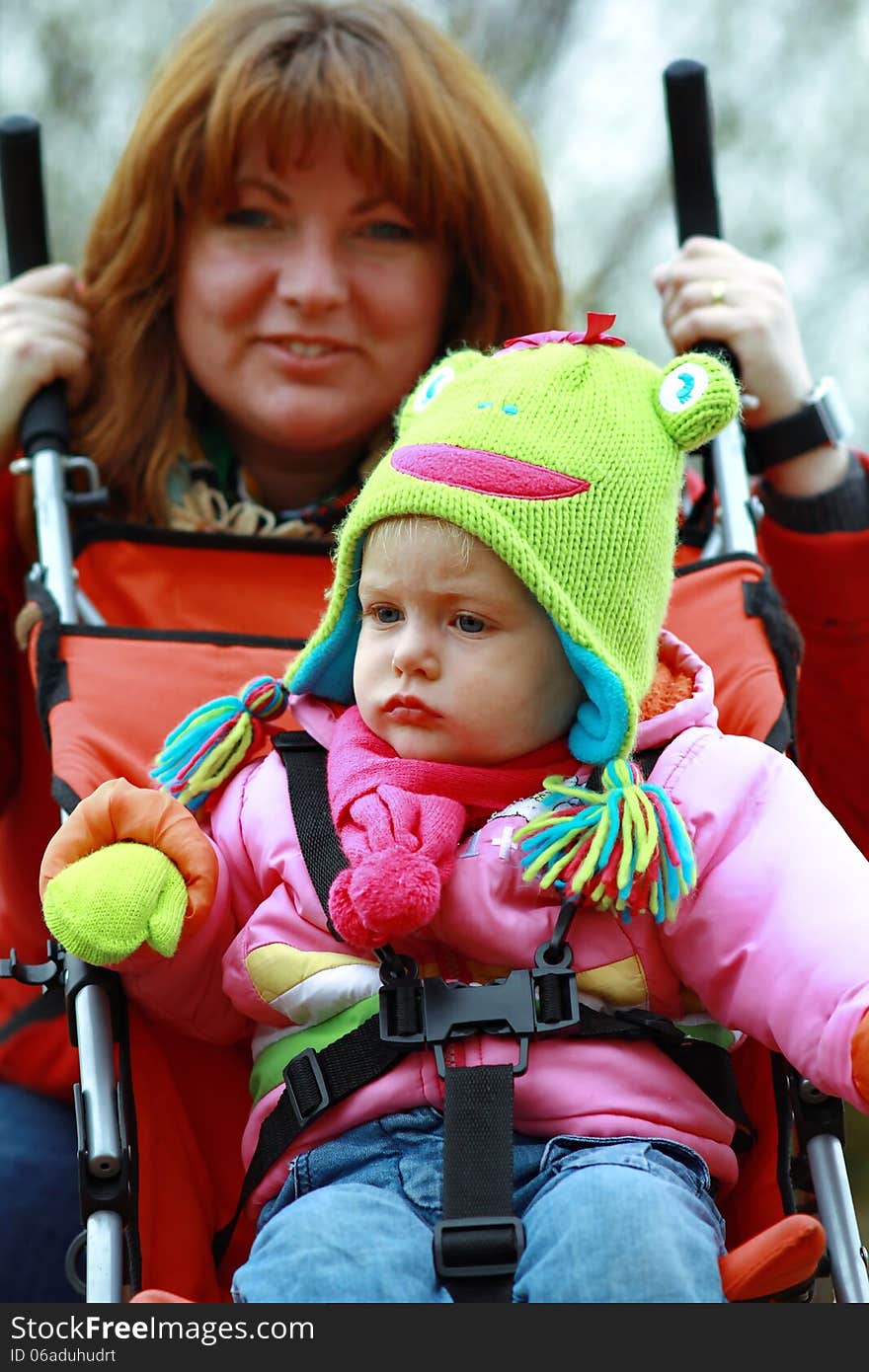 Amusing Baby Girl With Mum