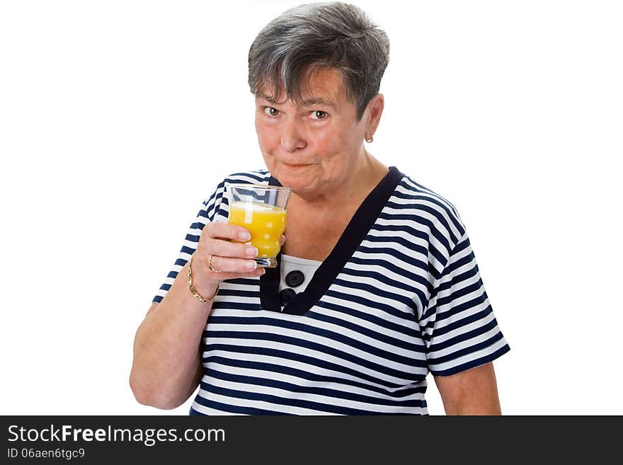 Senior woman drinking orange juice - isolated. Senior woman drinking orange juice - isolated