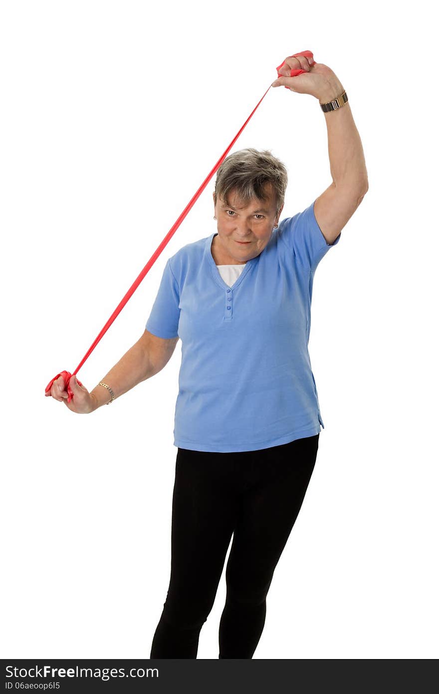 Senior woman exercising with rubber band - isolated. Senior woman exercising with rubber band - isolated