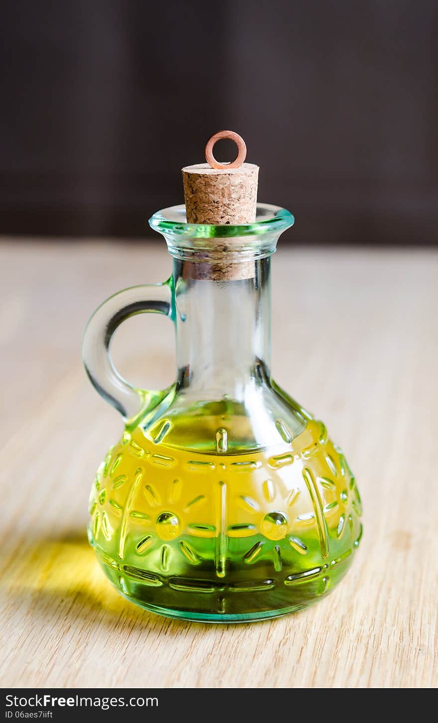 Small bottle of olive oil with cork stopper