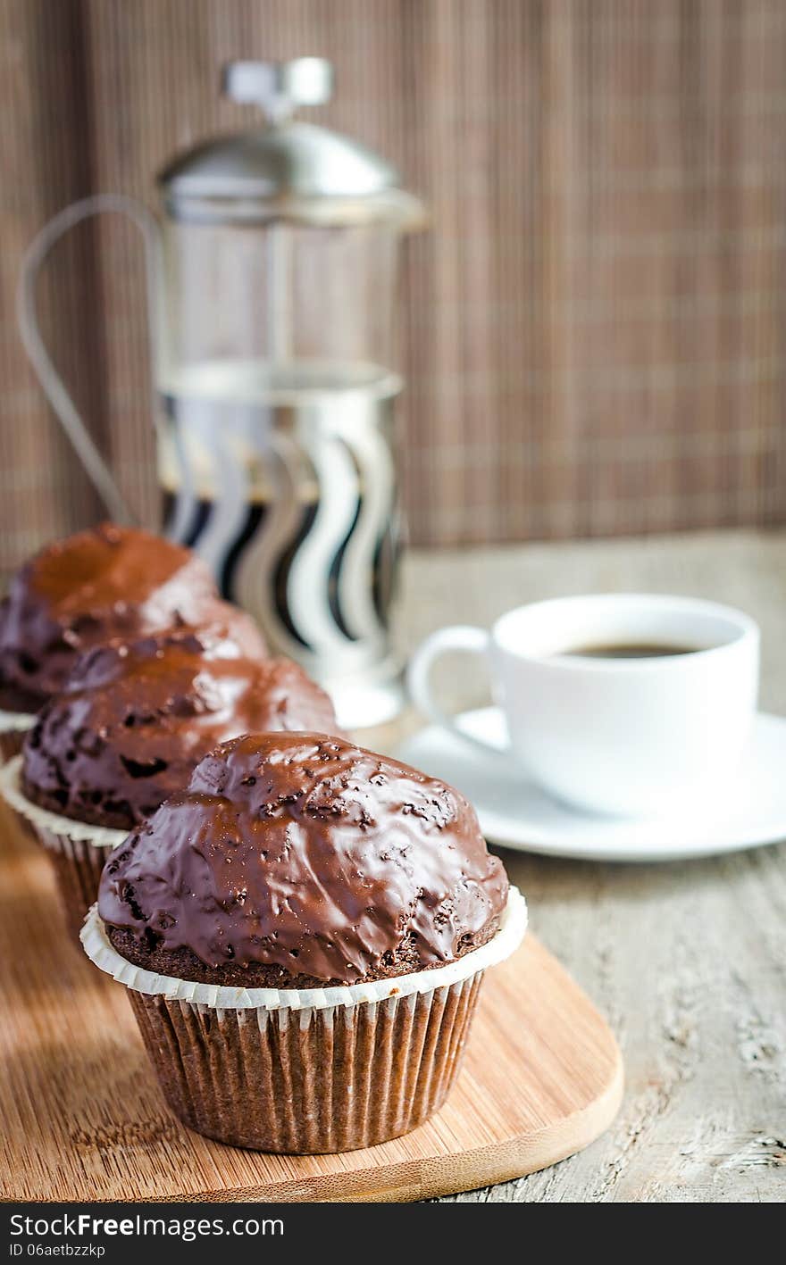 Three Chocolate muffins and coffee